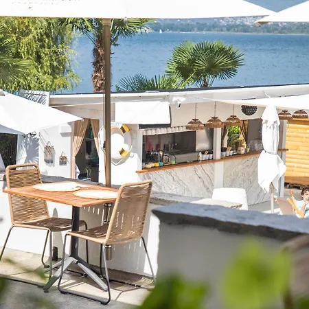 Riva Boutique I Club I Loges I Restaurant Szálloda Gambarogno